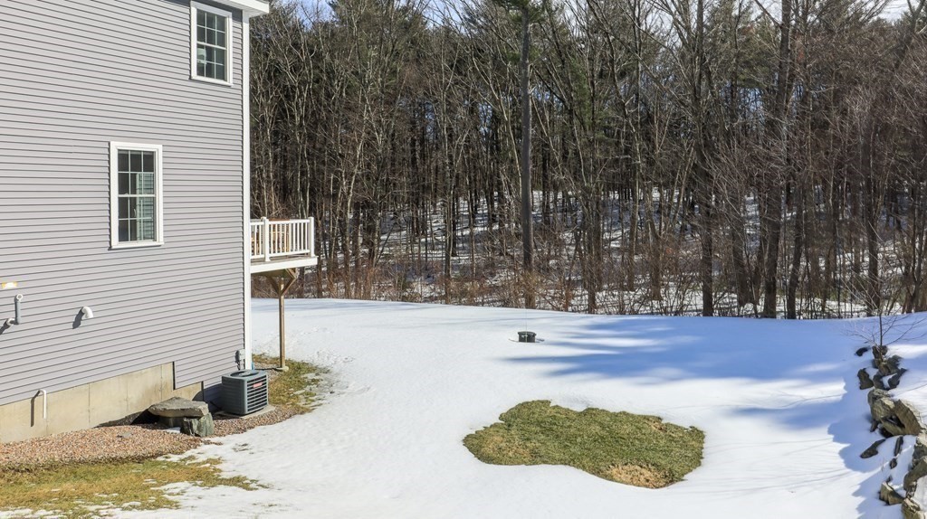 85 Dudley Road, Unit 85 Berlin, MA 01503 - Photo 34 of 39 a view of a terrace with a bench