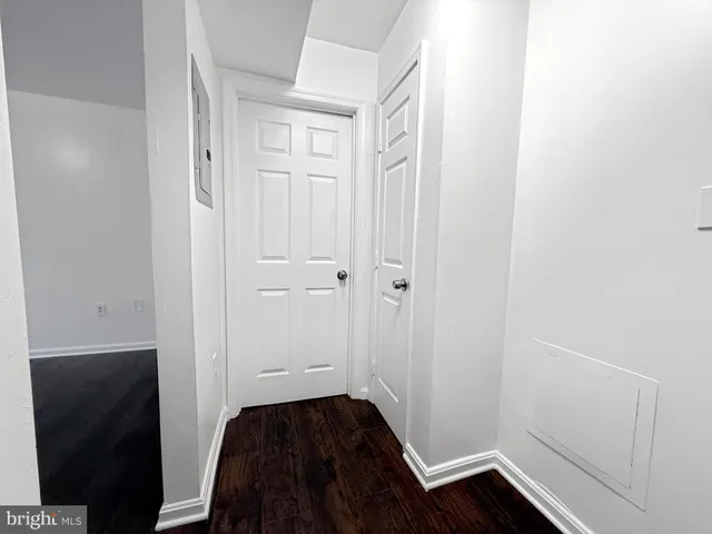 a view of door with wooden floor