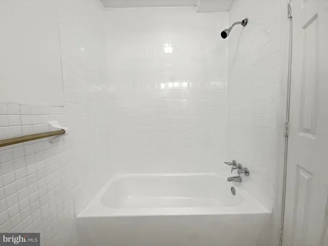 a close view of a bathtub in bathroom