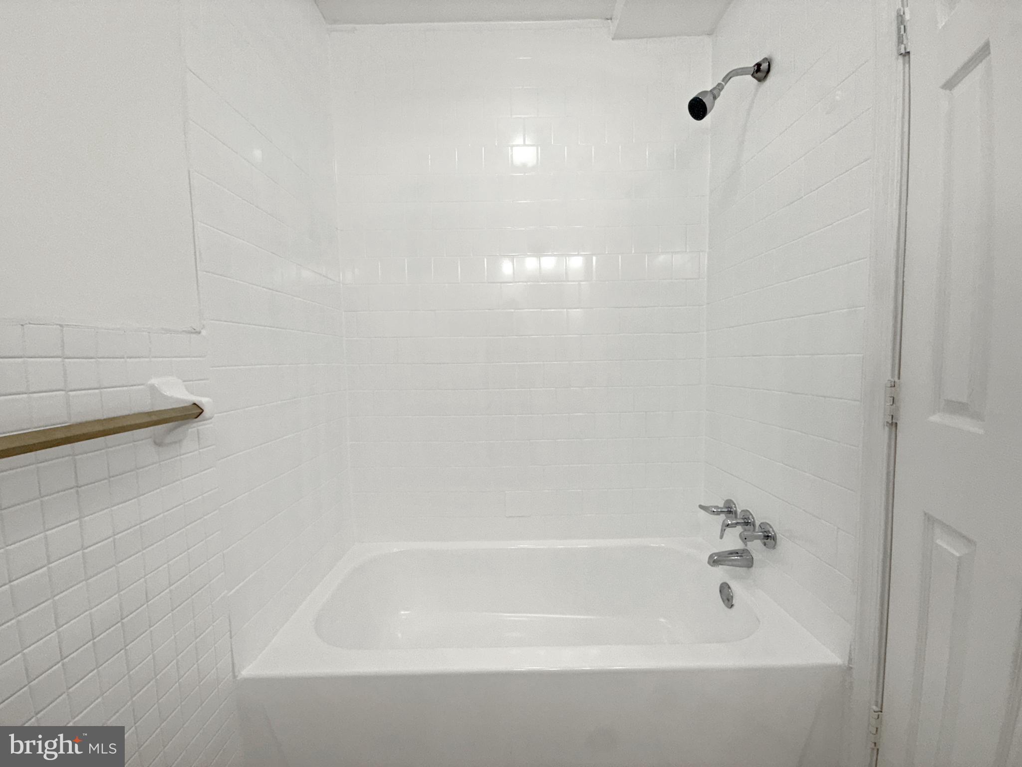 506 Eastern Avenue Northeast, Unit 102 Washington, DC 20019 - Photo 2 of 13 a close view of a bathtub in bathroom