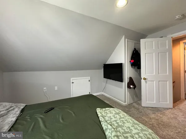 a living room with a couch and a fireplace