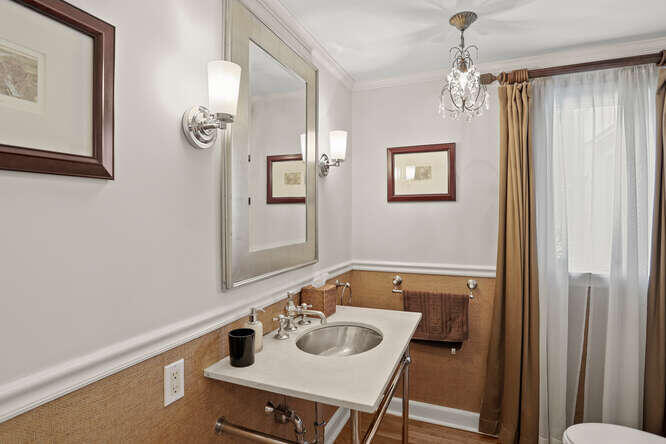40 Tulip Tree Lane Darien, CT 06820 - Photo 11 of 27 a bathroom with a sink and a mirror