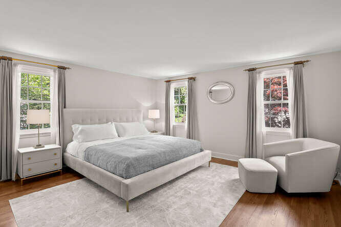 40 Tulip Tree Lane Darien, CT 06820 - Photo 12 of 27 a spacious bedroom with a bed and a couch