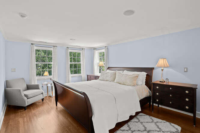 40 Tulip Tree Lane Darien, CT 06820 - Photo 13 of 27 a bedroom with a bed and a couch