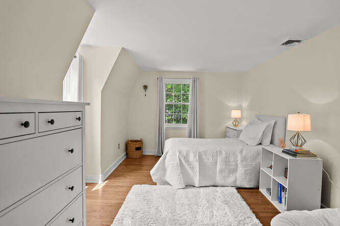 40 Tulip Tree Lane Darien, CT 06820 - Photo 15 of 27 a bedroom with a bed and a window