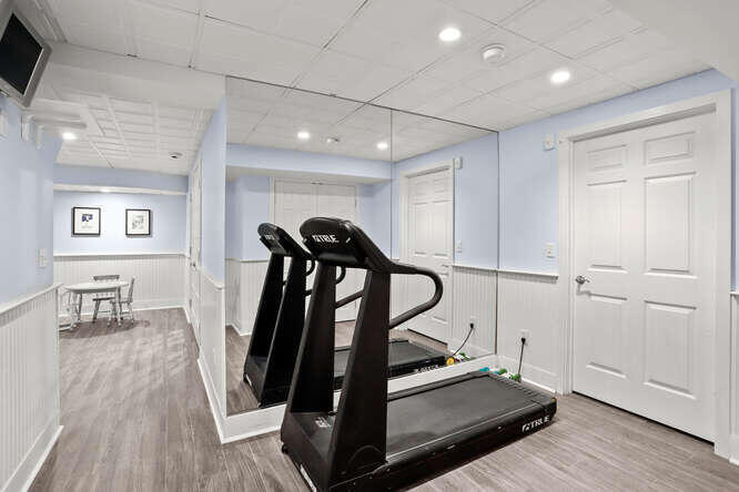 40 Tulip Tree Lane Darien, CT 06820 - Photo 20 of 27 a view of a room with gym equipment