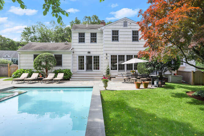 40 Tulip Tree Lane Darien, CT 06820 - Photo 2 of 27 a view of a house with sitting area and swimming pool