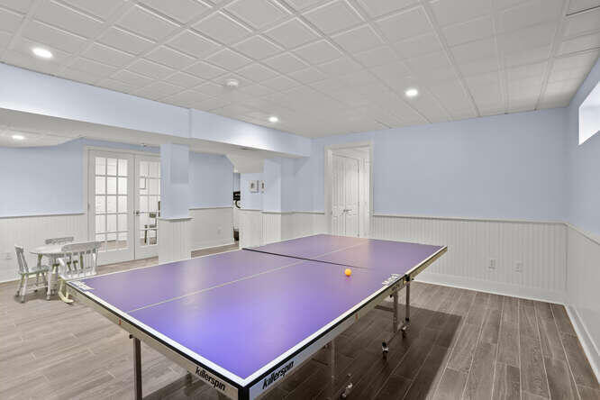 40 Tulip Tree Lane Darien, CT 06820 - Photo 21 of 27 a room with pool table and windows
