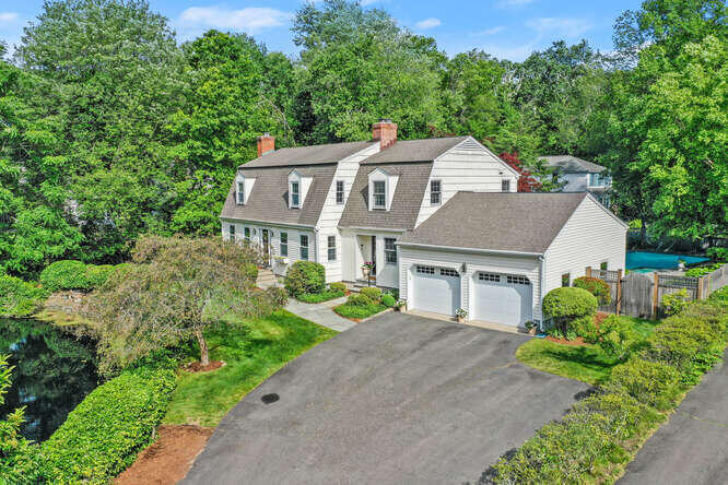 40 Tulip Tree Lane Darien, CT 06820 - Photo 22 of 27 front view of a house with a yard