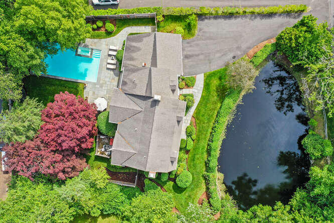 40 Tulip Tree Lane Darien, CT 06820 - Photo 23 of 27 an aerial view of a house with a yard