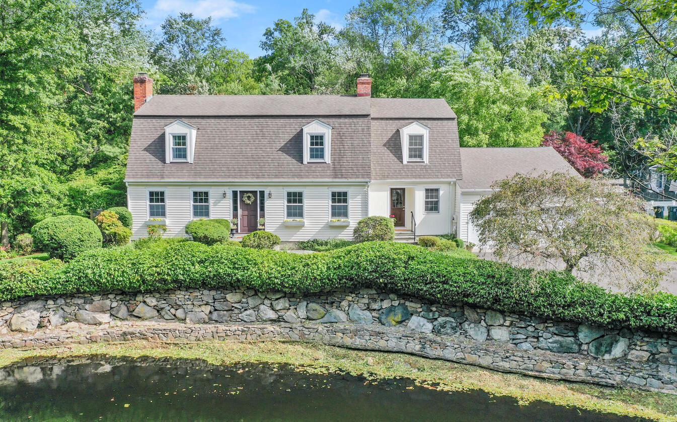 40 Tulip Tree Lane Darien, CT 06820 - Photo 3 of 27 a aerial view of a house with swimming pool and a yard