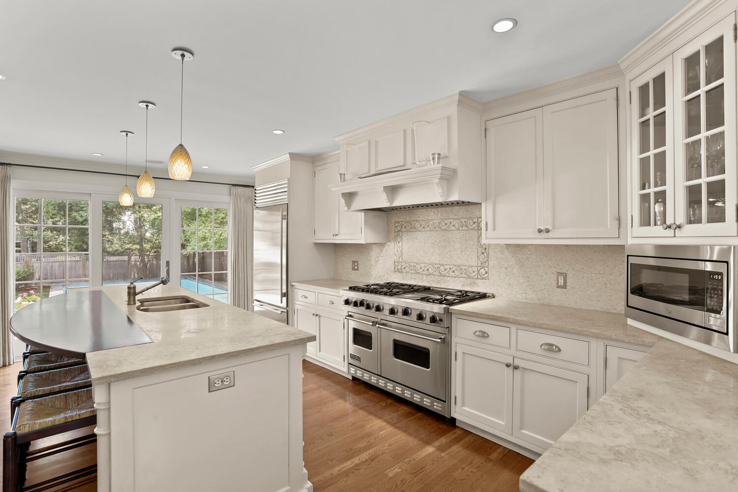 40 Tulip Tree Lane Darien, CT 06820 - Photo 5 of 27 a kitchen with granite countertop a sink stainless steel appliances and cabinets