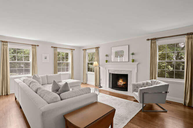 40 Tulip Tree Lane Darien, CT 06820 - Photo 8 of 27 a living room with furniture and a fireplace