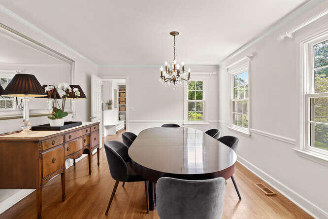 40 Tulip Tree Lane Darien, CT 06820 - Photo 9 of 27 a view of a dining room with furniture window and wooden floor