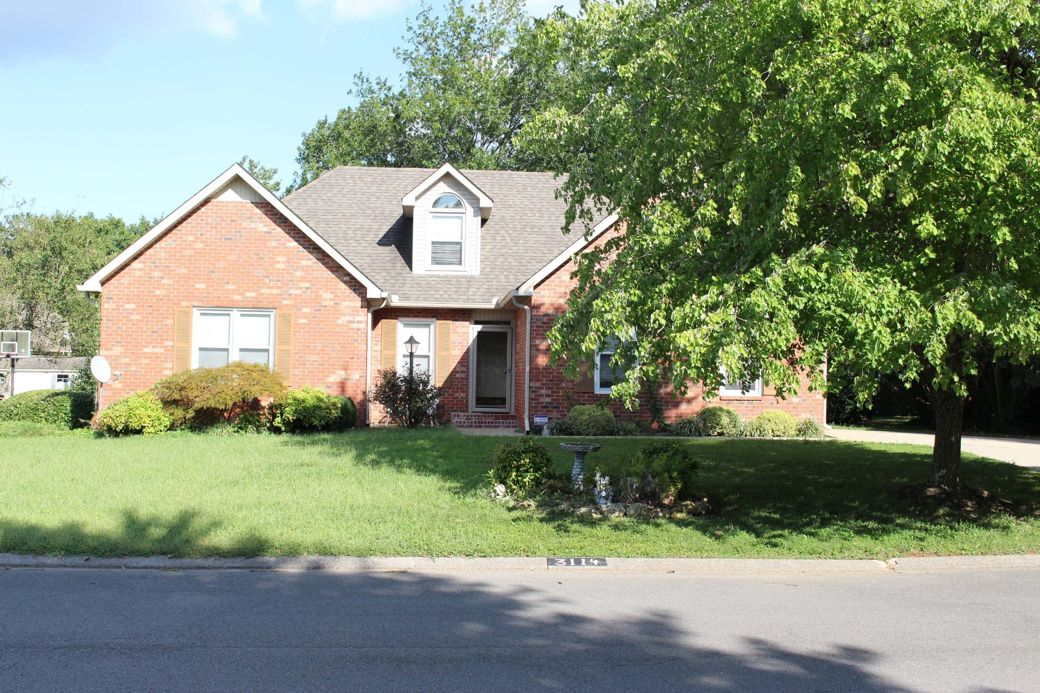 3114 Chanda Lane Murfreesboro, TN 37129 - Photo 2 of 12 a front view of a house with a yard and garage