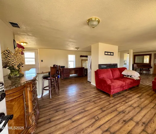 a bed room with furniture and wooden floor