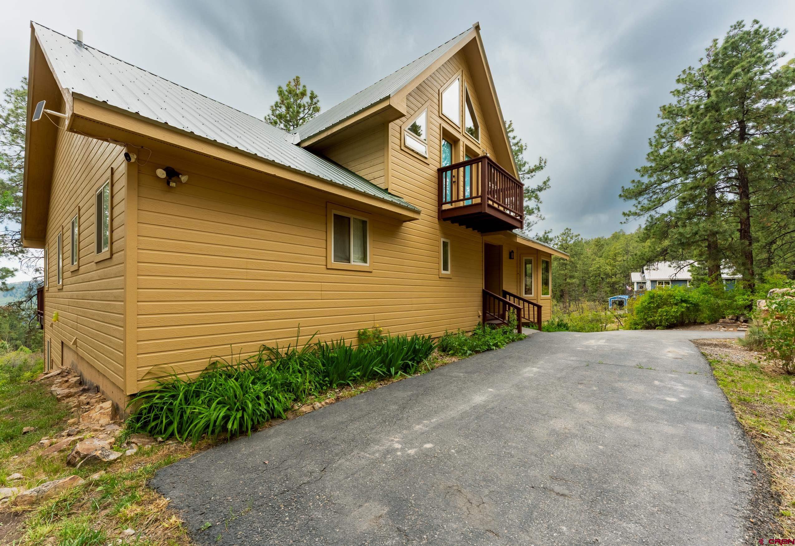 197 Buckhorn Road Bayfield, CO 81122 - Photo 28 of 34 a view of a house with a yard