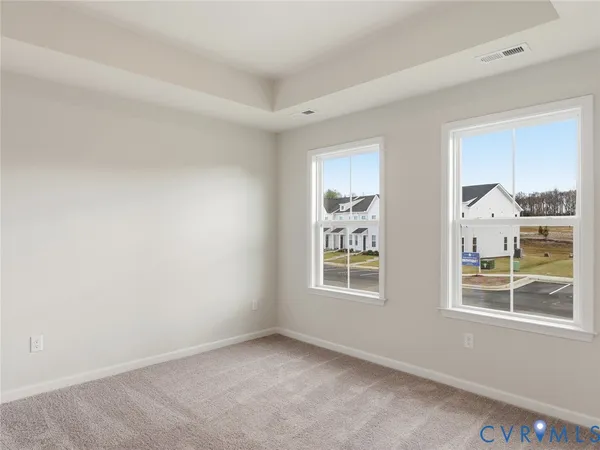 a bathroom with a double vanity sink mirror and shower