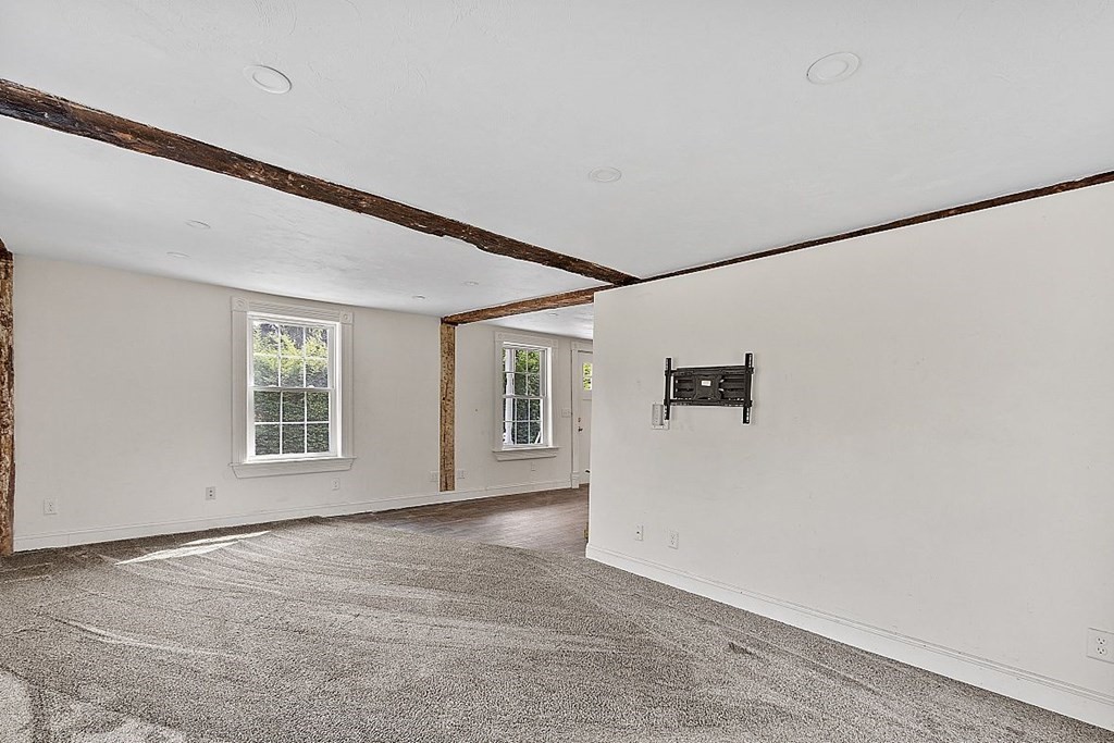 230 7 Bridge Road Lancaster, MA 01523 - Photo 11 of 33 a view of an empty room with a window