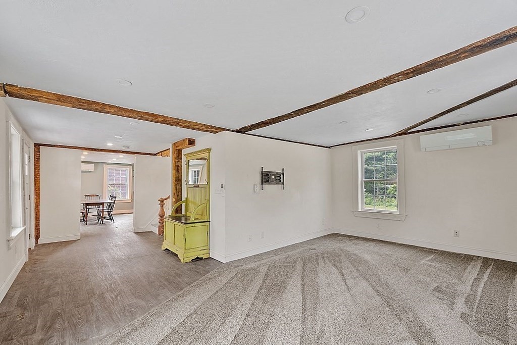 230 7 Bridge Road Lancaster, MA 01523 - Photo 12 of 33 a view of empty room with wooden floor and window