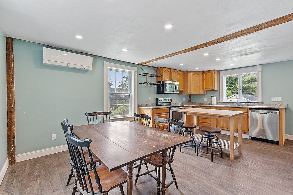 230 7 Bridge Road Lancaster, MA 01523 - Photo 13 of 33 a view of a dining room with furniture and wooden floor