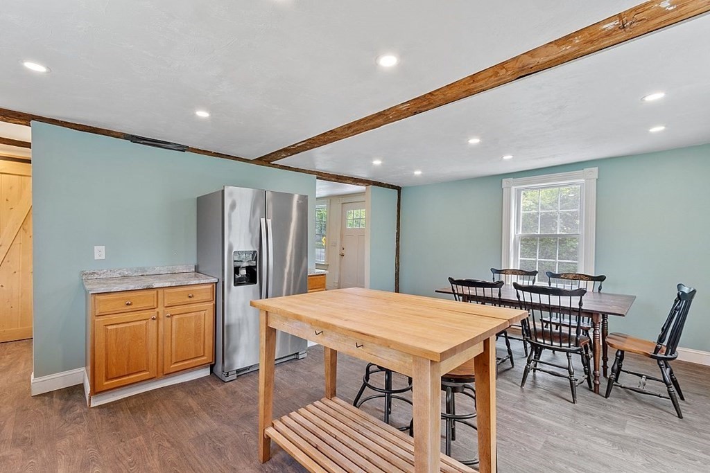 230 7 Bridge Road Lancaster, MA 01523 - Photo 18 of 33 a kitchen with a table and chairs in it