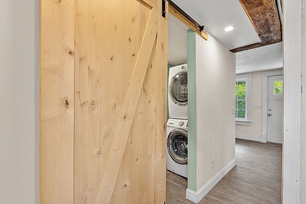 230 7 Bridge Road Lancaster, MA 01523 - Photo 20 of 33 a view of a hallway with washer and dryer