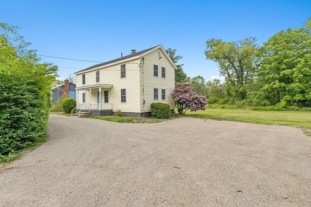 230 7 Bridge Road Lancaster, MA 01523 - Photo 2 of 33 a view of a house with a yard