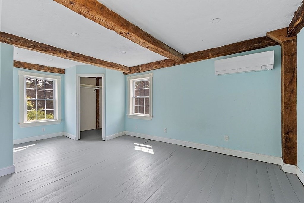 230 7 Bridge Road Lancaster, MA 01523 - Photo 25 of 33 an empty room with wooden floor and windows