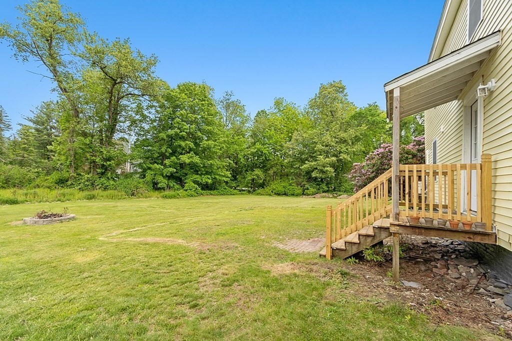 230 7 Bridge Road Lancaster, MA 01523 - Photo 3 of 33 a view of a swimming pool with an outdoor seating and a garden