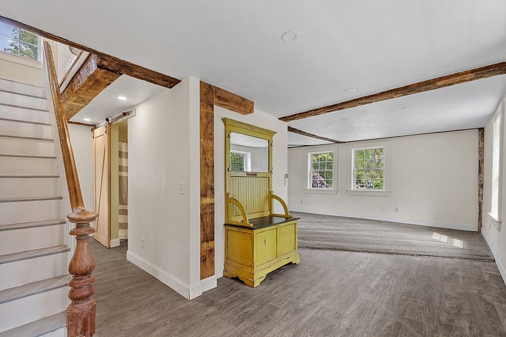 230 7 Bridge Road Lancaster, MA 01523 - Photo 8 of 33 a view of entryway with wooden floor and stairs