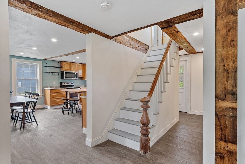 230 7 Bridge Road Lancaster, MA 01523 - Photo 9 of 33 a view of dining room with furniture and wooden floor