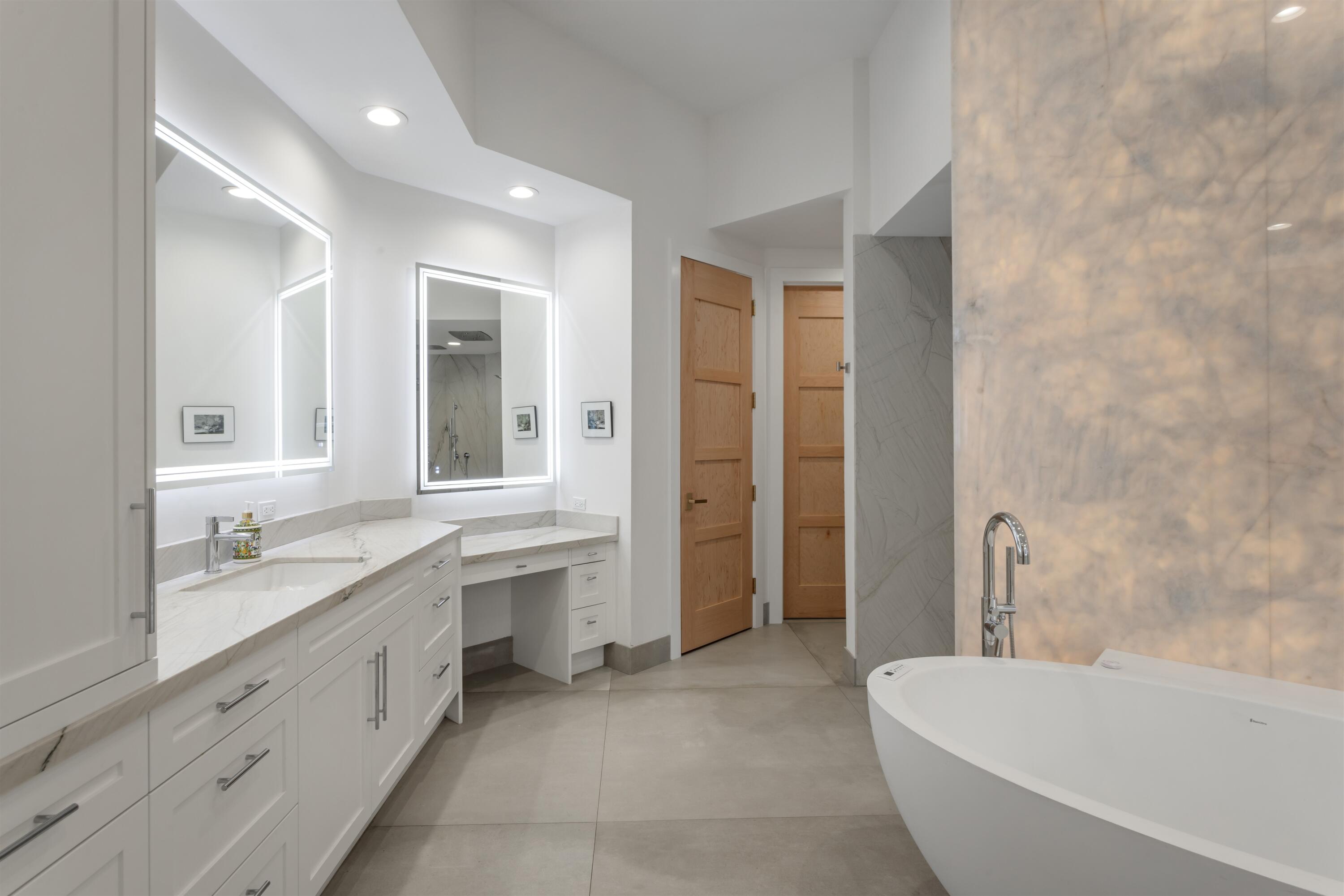 4698 Sanctuary Lane Boca Raton, FL 33431 - Photo 23 of 43 a bathroom with a granite countertop sink and mirror with bathtub