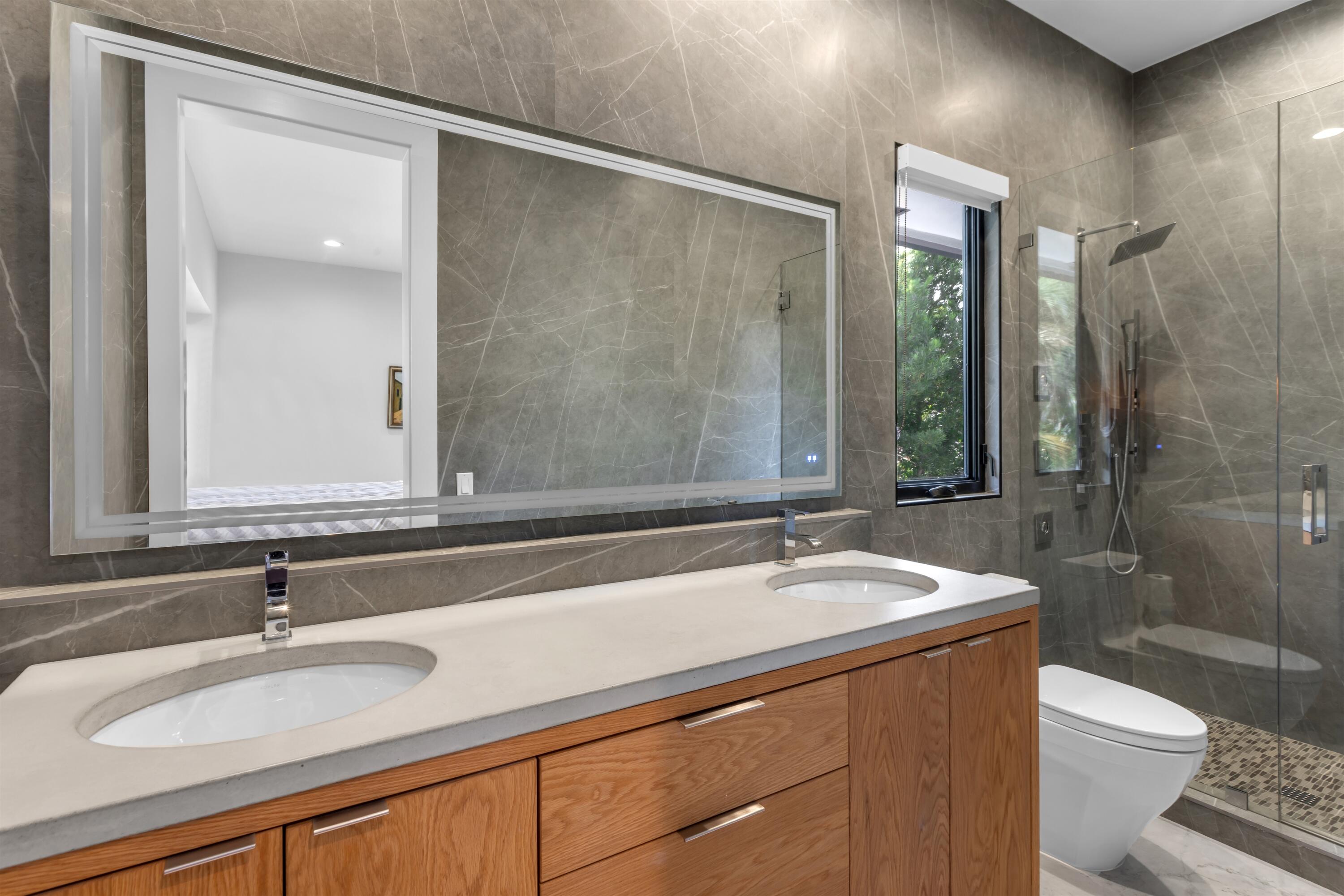 4698 Sanctuary Lane Boca Raton, FL 33431 - Photo 33 of 43 a bathroom with a sink and a mirror