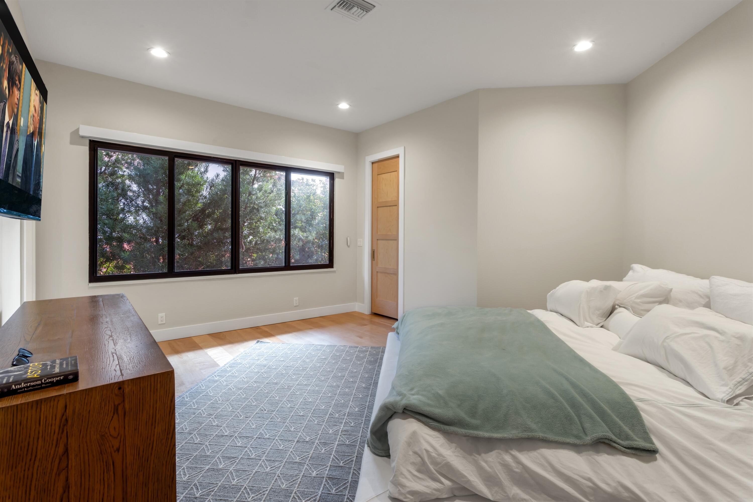 4698 Sanctuary Lane Boca Raton, FL 33431 - Photo 34 of 43 a bedroom with a large bed and a large window