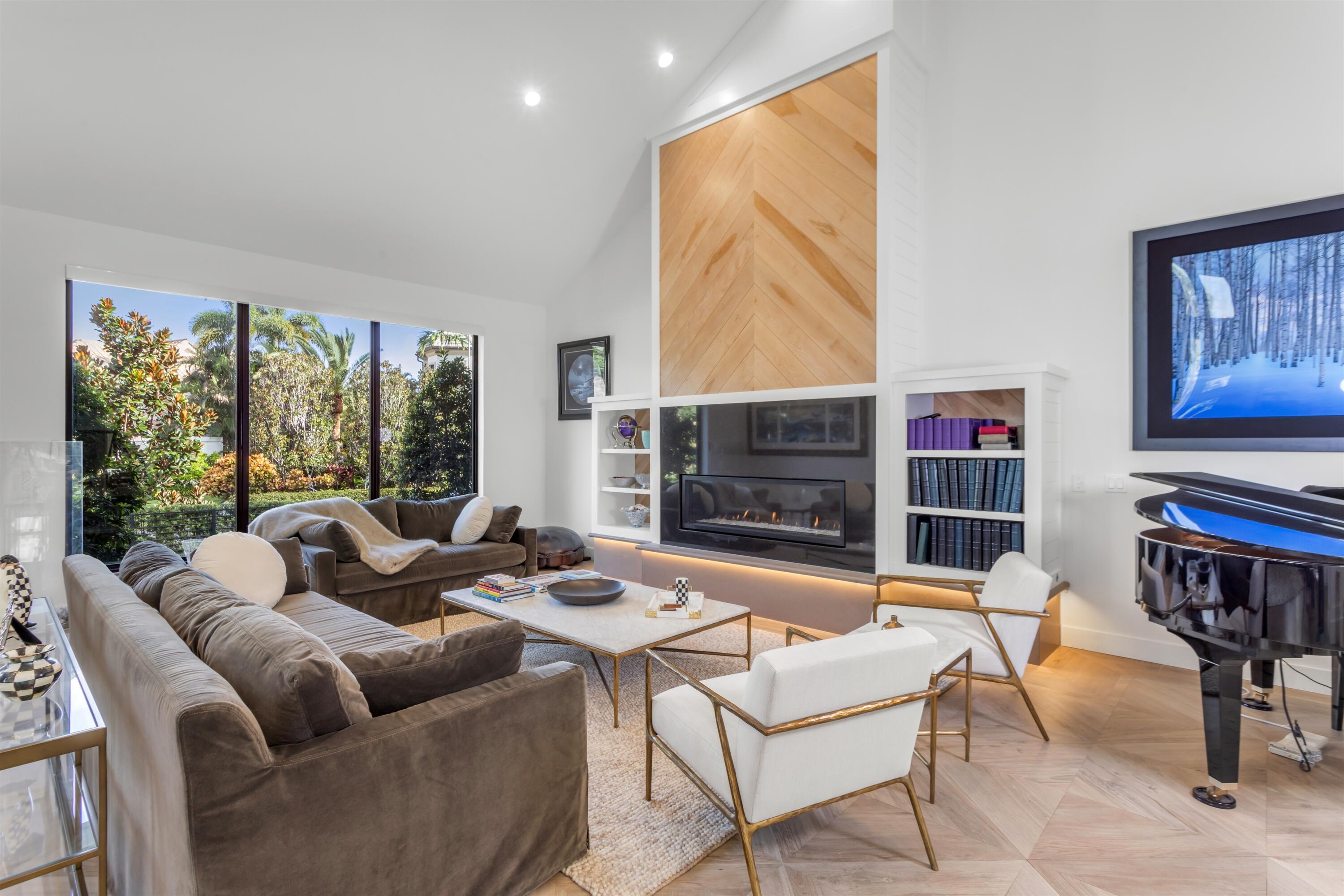 4698 Sanctuary Lane Boca Raton, FL 33431 - Photo 8 of 43 a living room with fireplace furniture and a large window