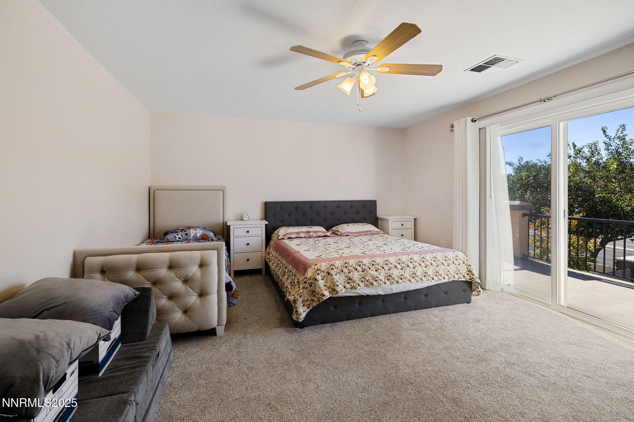 1876 Braemore Drive Reno, NV 89521 - Photo 14 of 34 a bedroom with a bed and a large window