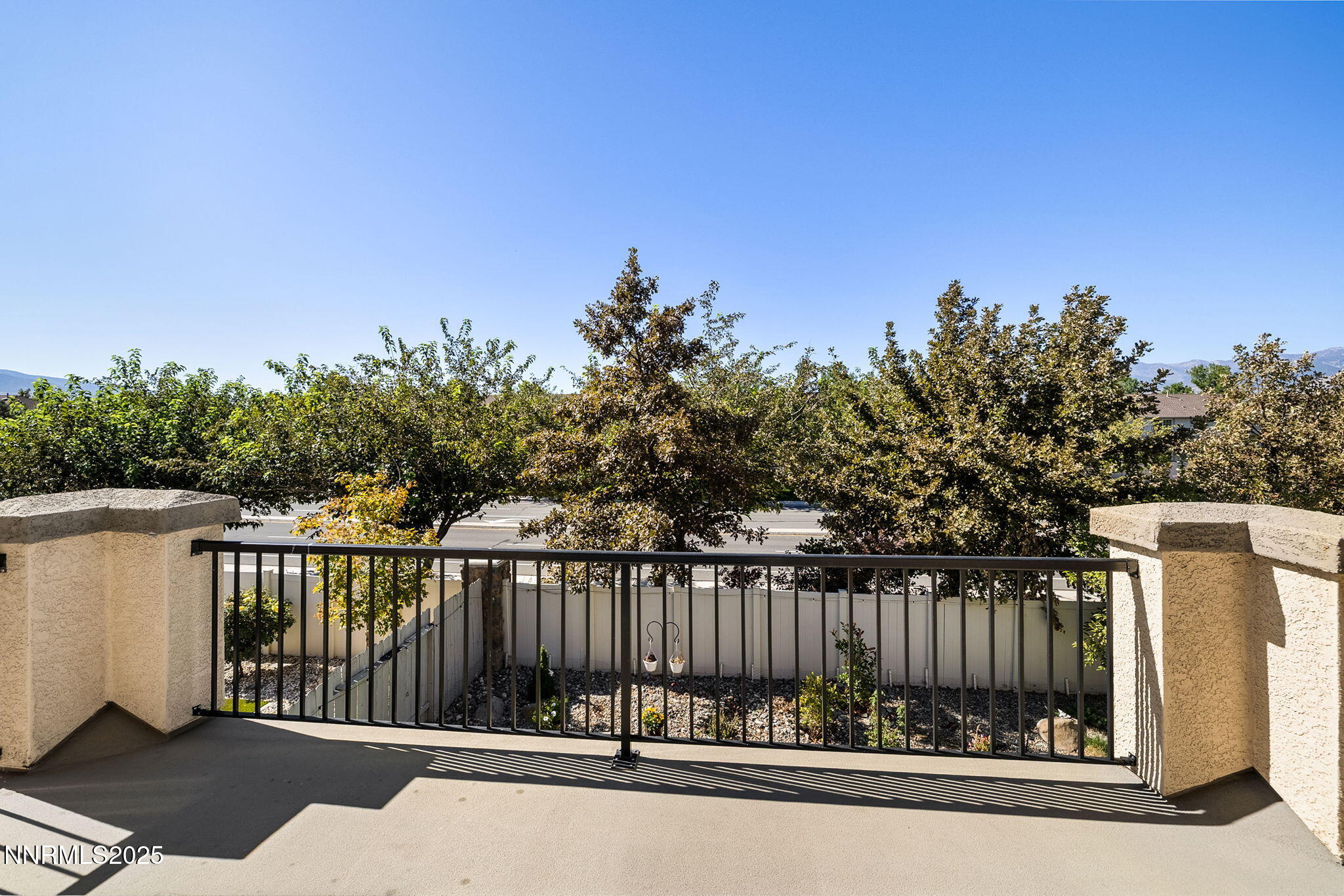 1876 Braemore Drive Reno, NV 89521 - Photo 16 of 34 a view of a balcony with a floor to ceiling window and wooden fence