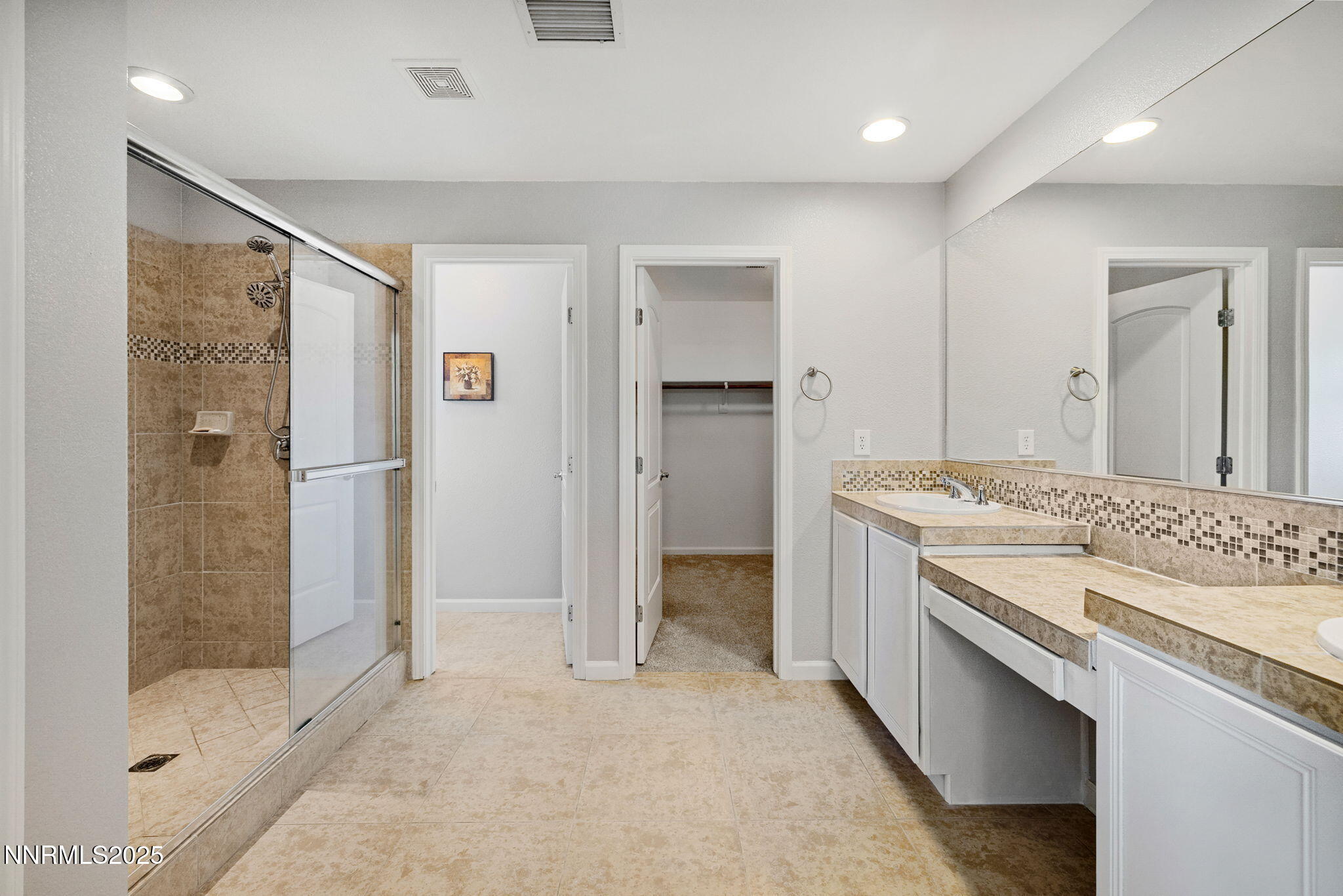 1876 Braemore Drive Reno, NV 89521 - Photo 19 of 34 a bathroom with a granite countertop sink mirror and shower