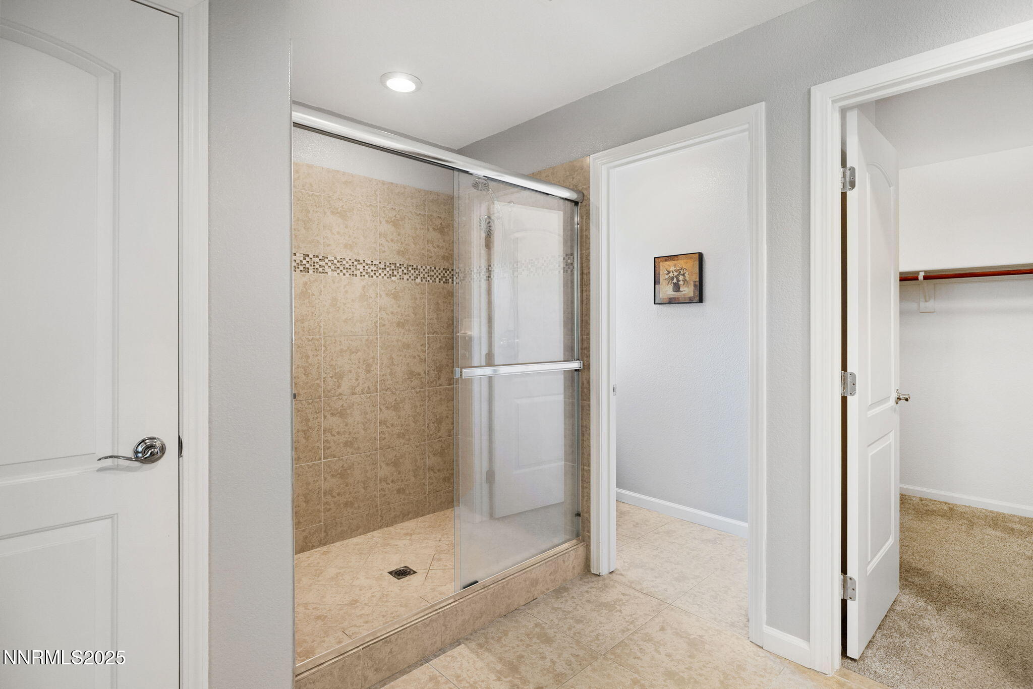 1876 Braemore Drive Reno, NV 89521 - Photo 21 of 34 a bathroom with a glass shower door and a sink