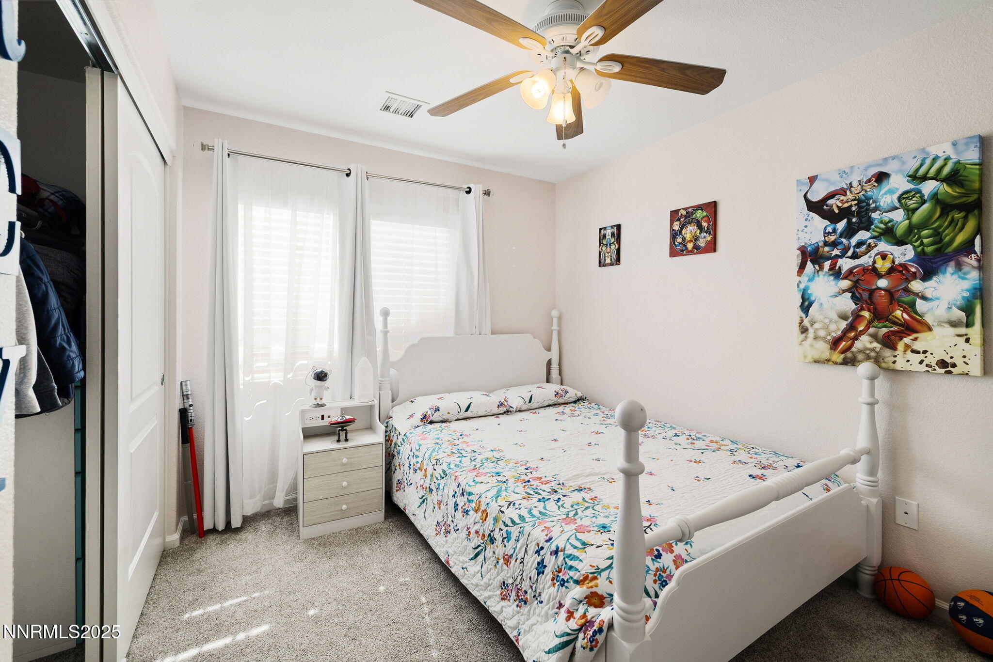 1876 Braemore Drive Reno, NV 89521 - Photo 24 of 34 a bedroom with a bed and a chandelier