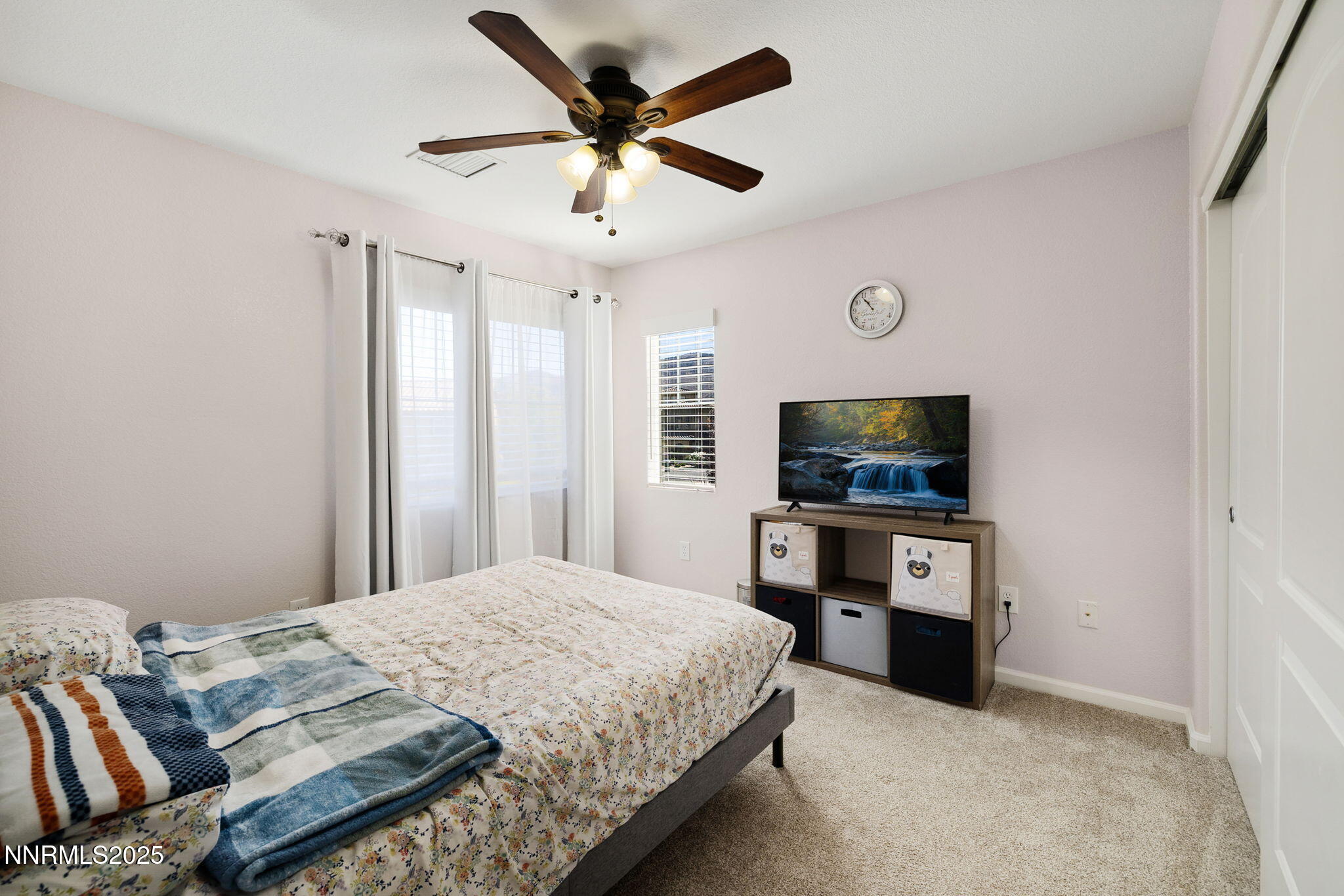 1876 Braemore Drive Reno, NV 89521 - Photo 27 of 34 a bedroom with a bed and a flat screen tv