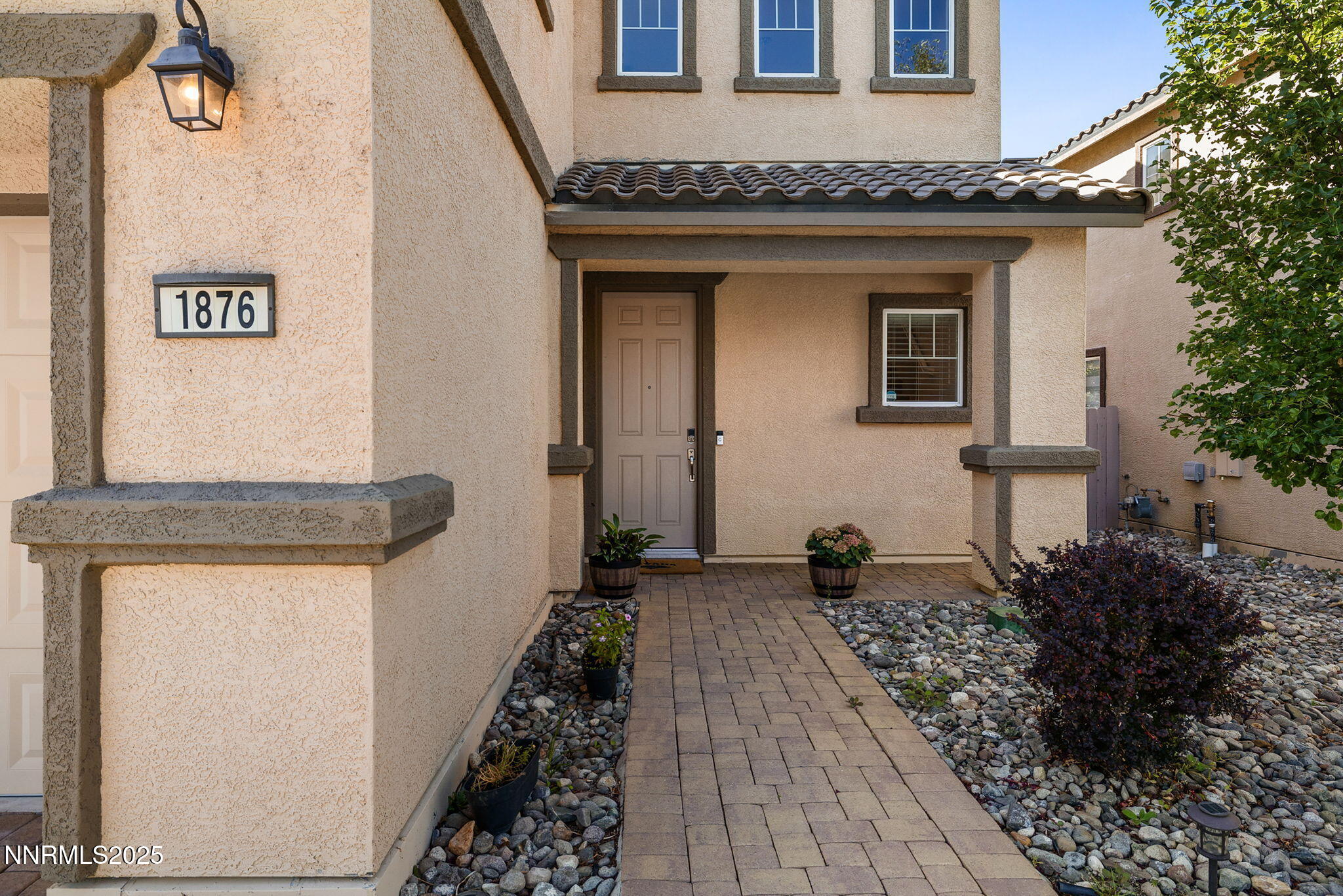 1876 Braemore Drive Reno, NV 89521 - Photo 3 of 34 a front view of a house with table and chairs