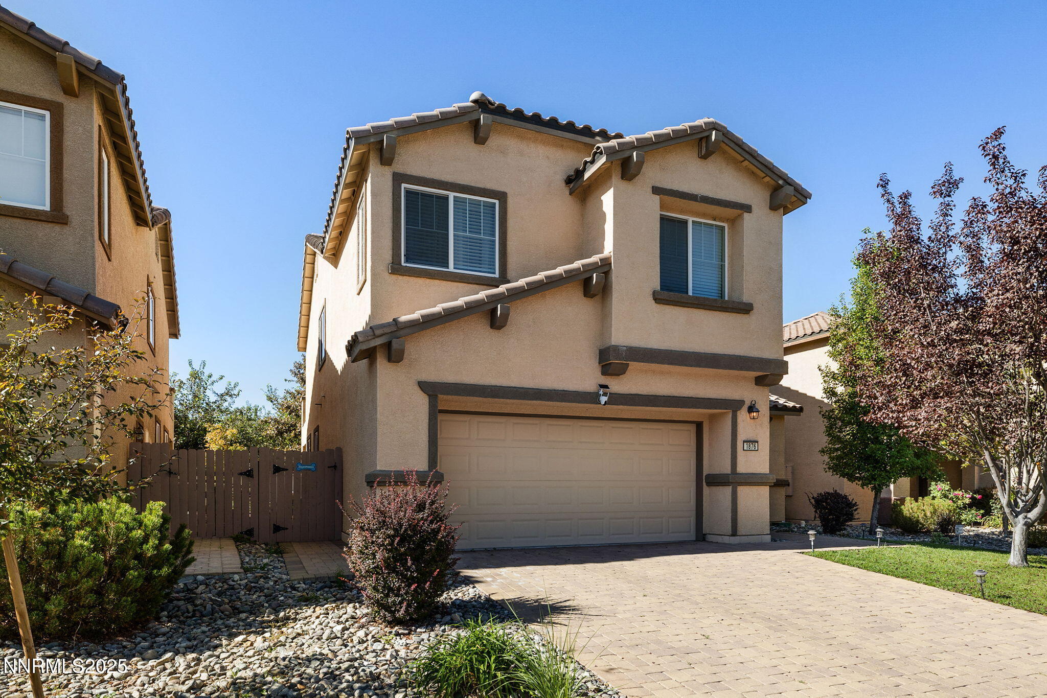 1876 Braemore Drive Reno, NV 89521 - Photo 33 of 34 a front view of a house with a yard and garage