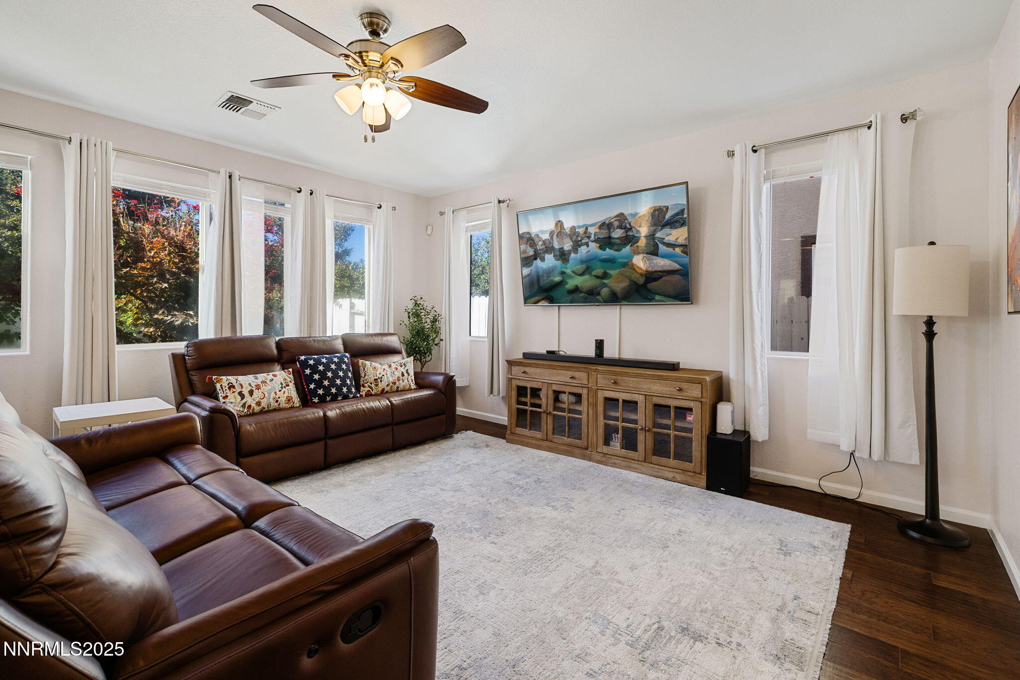 1876 Braemore Drive Reno, NV 89521 - Photo 7 of 34 a living room with furniture and a flat screen tv