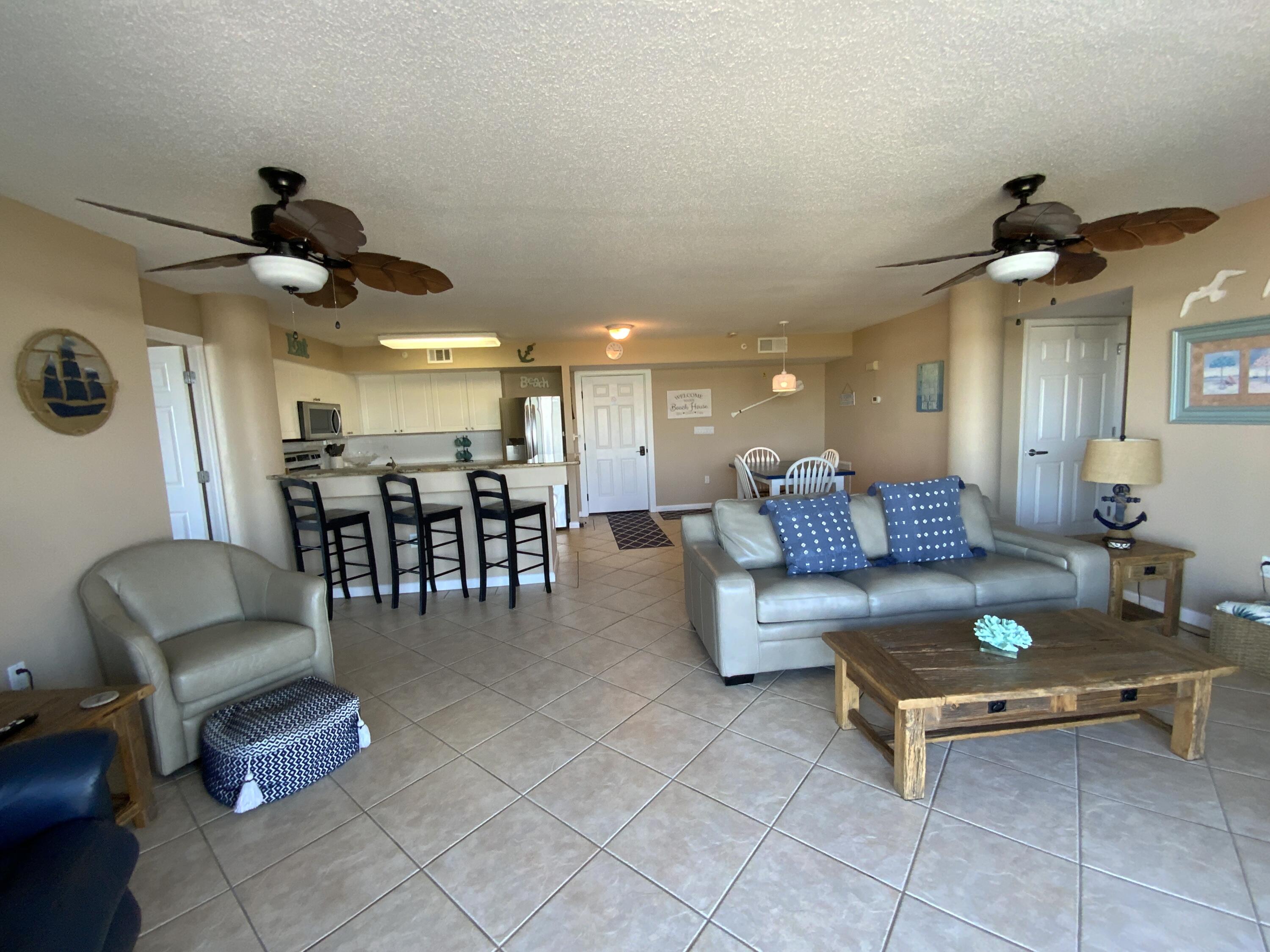 670 Santa Rosa Boulevard, Unit 503 Fort Walton Beach, FL 32548 - Photo 11 of 44 a living room with furniture and kitchen view