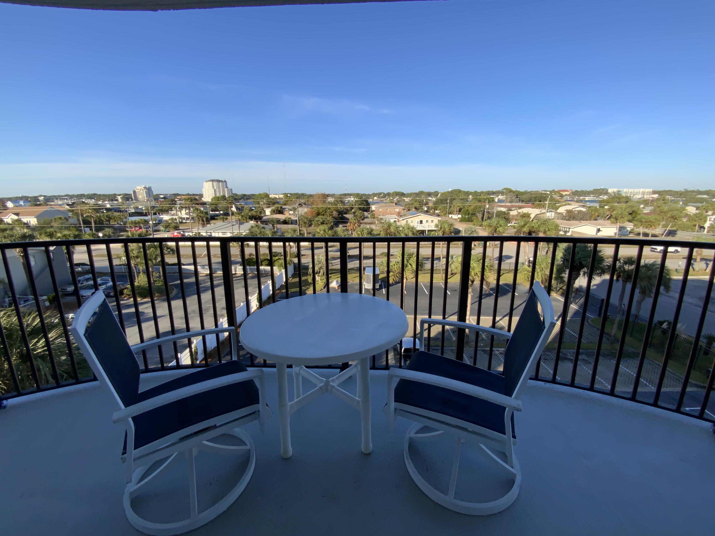 670 Santa Rosa Boulevard, Unit 503 Fort Walton Beach, FL 32548 - Photo 14 of 44 a view of a balcony with an outdoor seating