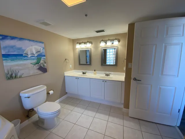a large bathroom with a large tub and sink