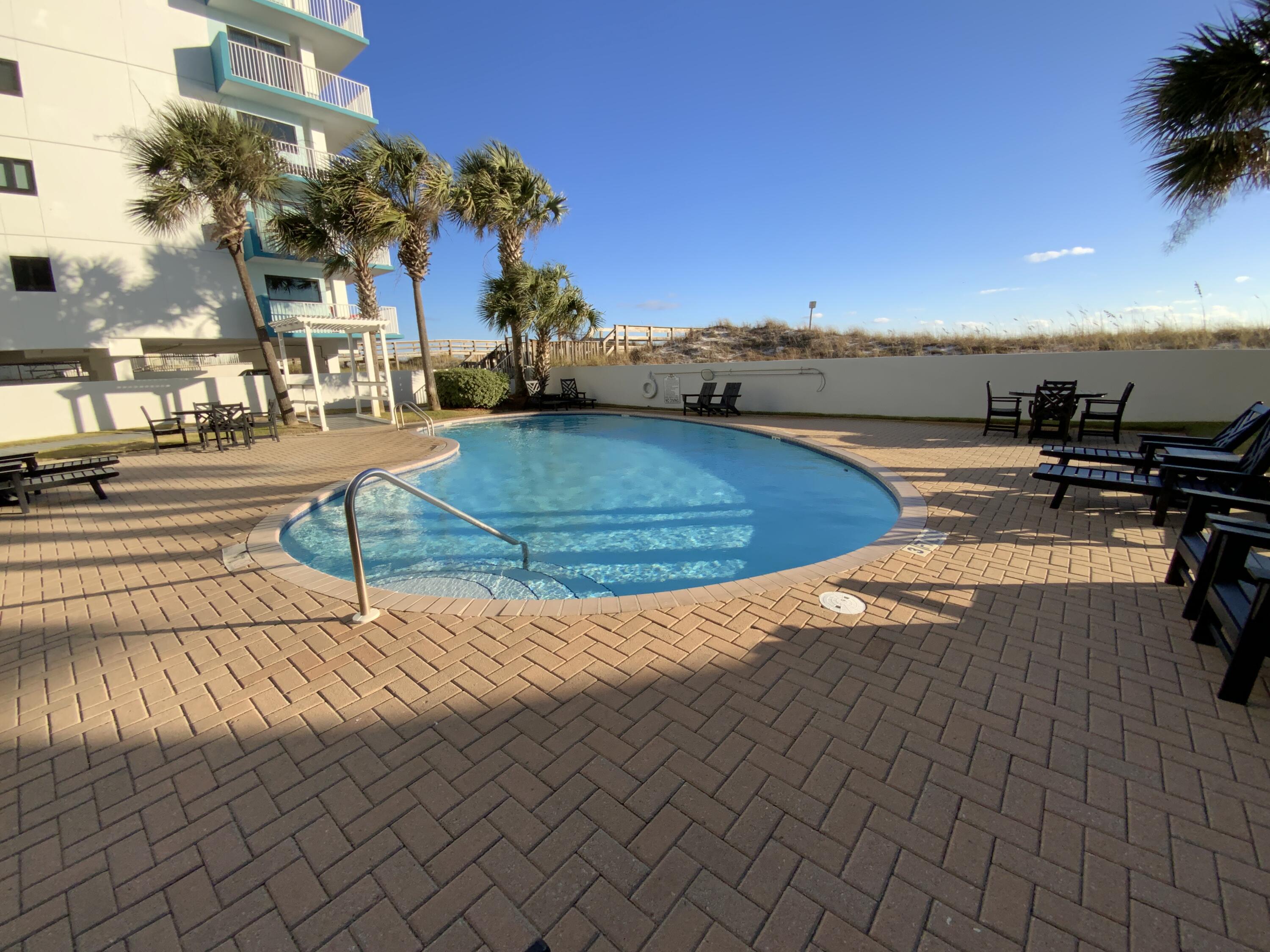 670 Santa Rosa Boulevard, Unit 503 Fort Walton Beach, FL 32548 - Photo 37 of 44 a view of a swimming pool with an outdoor seating