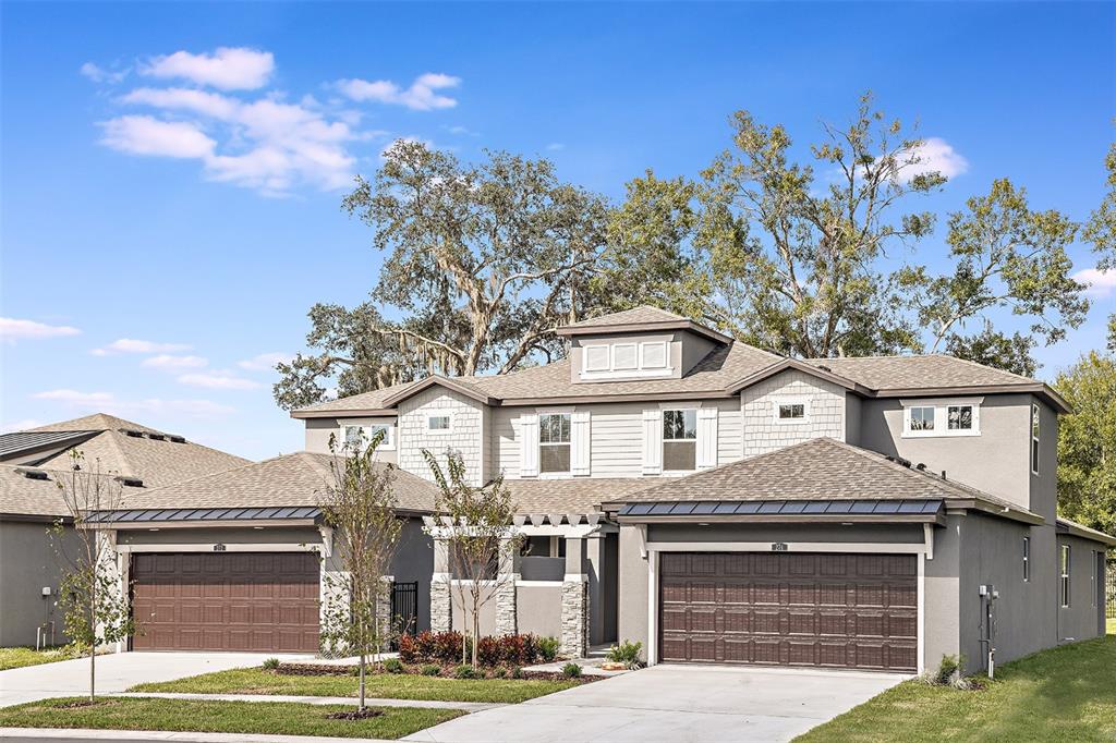 318 Villa Corte Drive Lutz, FL 33549 - Photo 1 of 13 a front view of a house with a yard